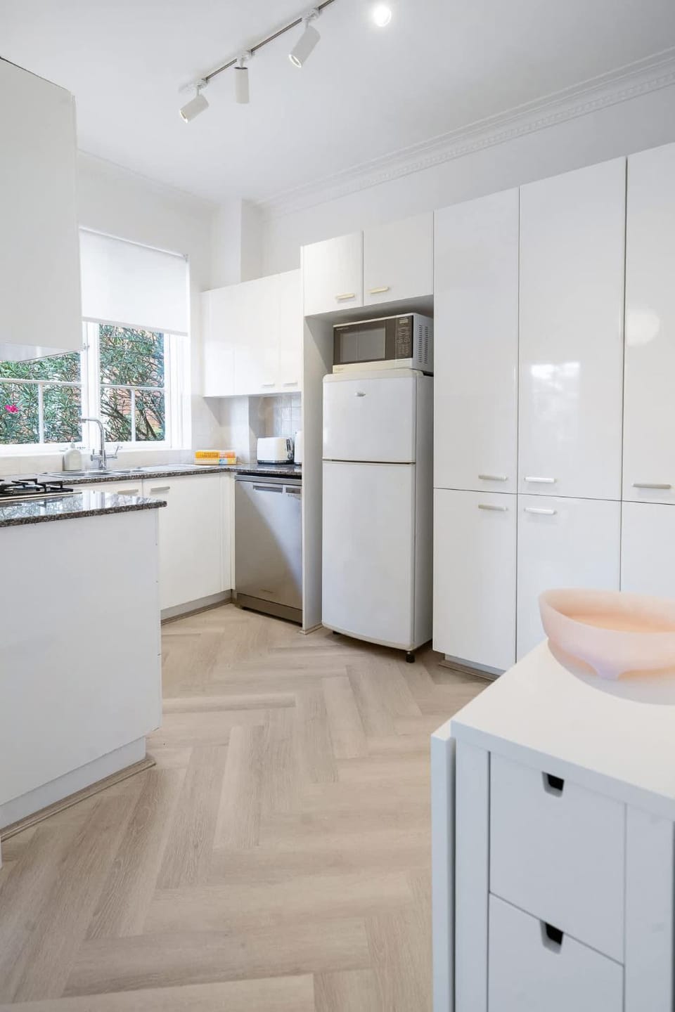 Kitchen or kitchenette, dishwasher, oven, stove