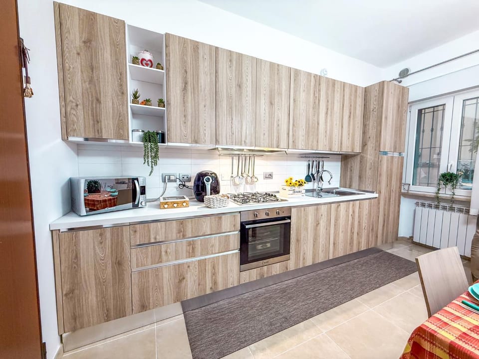 Kitchen or kitchenette, microwave, oven, stove