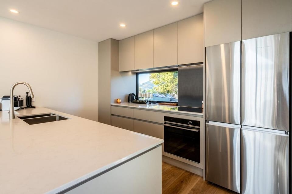 Kitchen or kitchenette, dishwasher, oven, stove