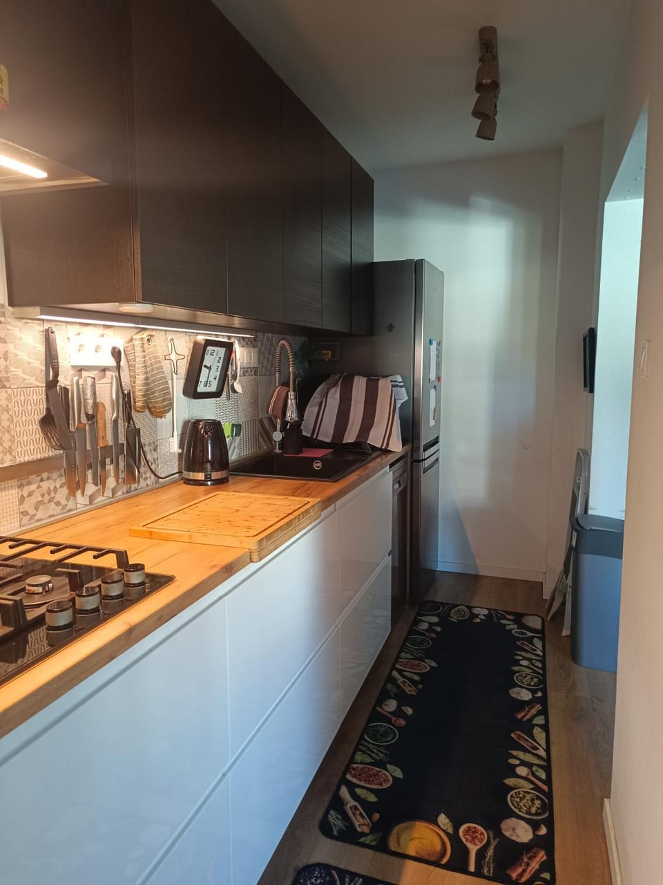 Kitchen or kitchenette, dishwasher, stove, toaster