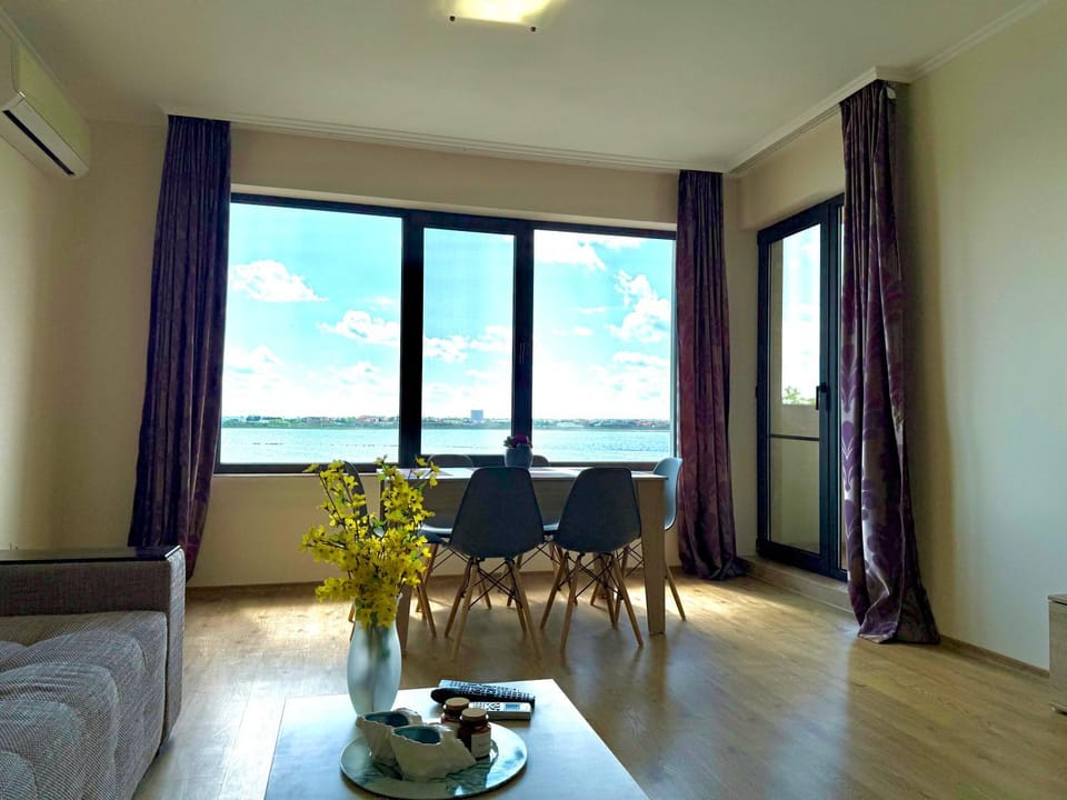 Natural landscape, View (from property/room), Living room, Seating area, Dining area, Lake view, Sea view