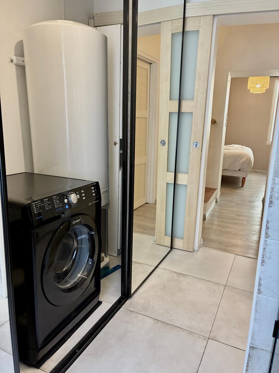 Toilet, flat iron, hair dryier, towels, washing machine