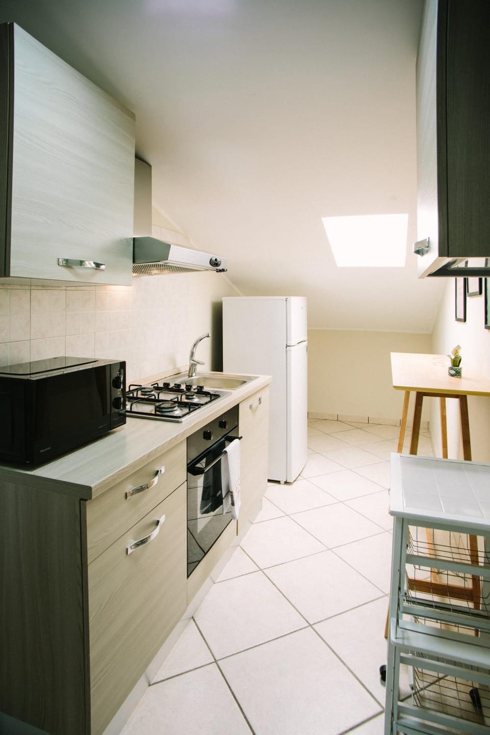 Kitchen or kitchenette, microwave, oven, stove