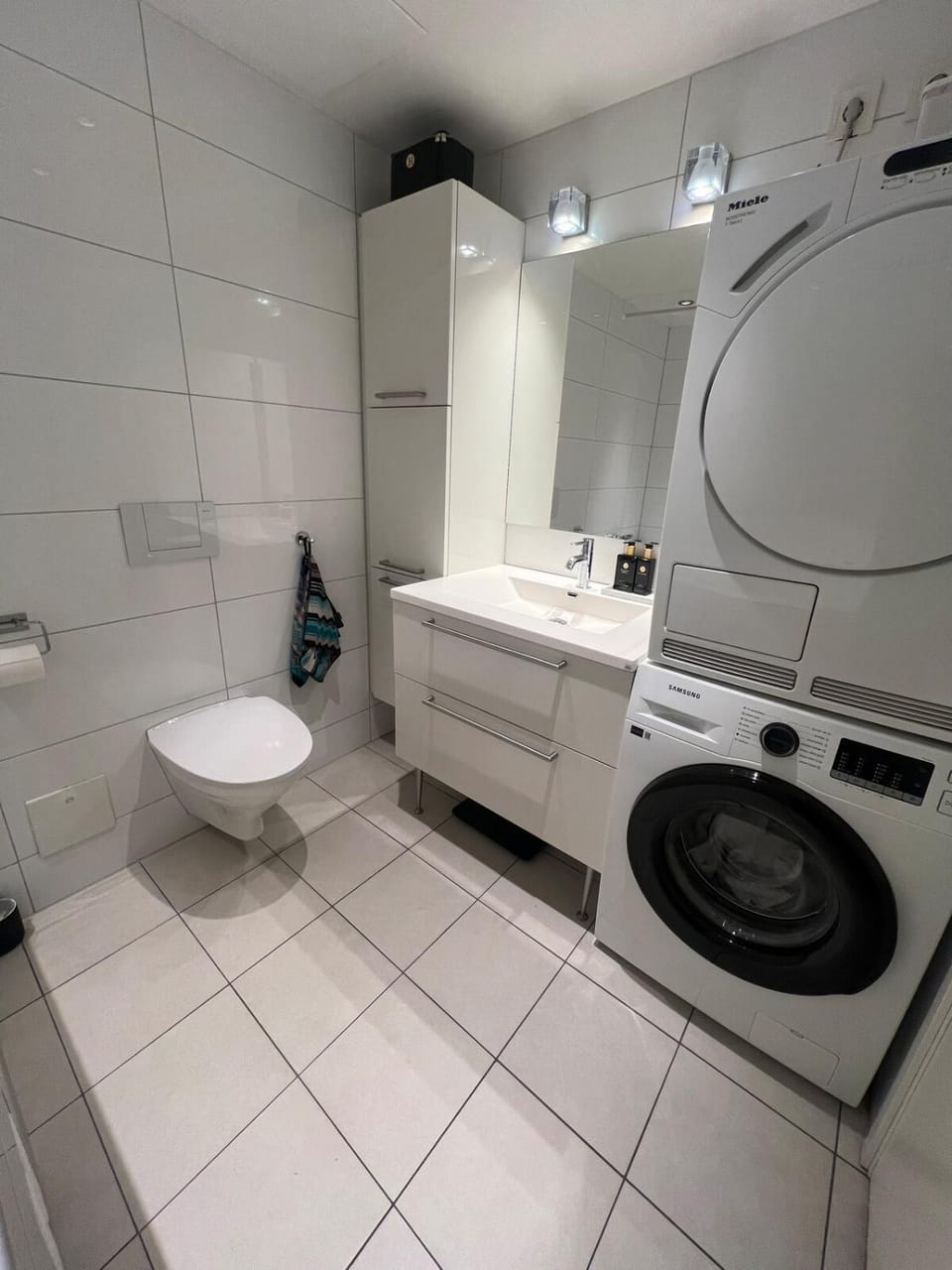 Shower, Toilet, Bathroom, towels, washing machine, dryer