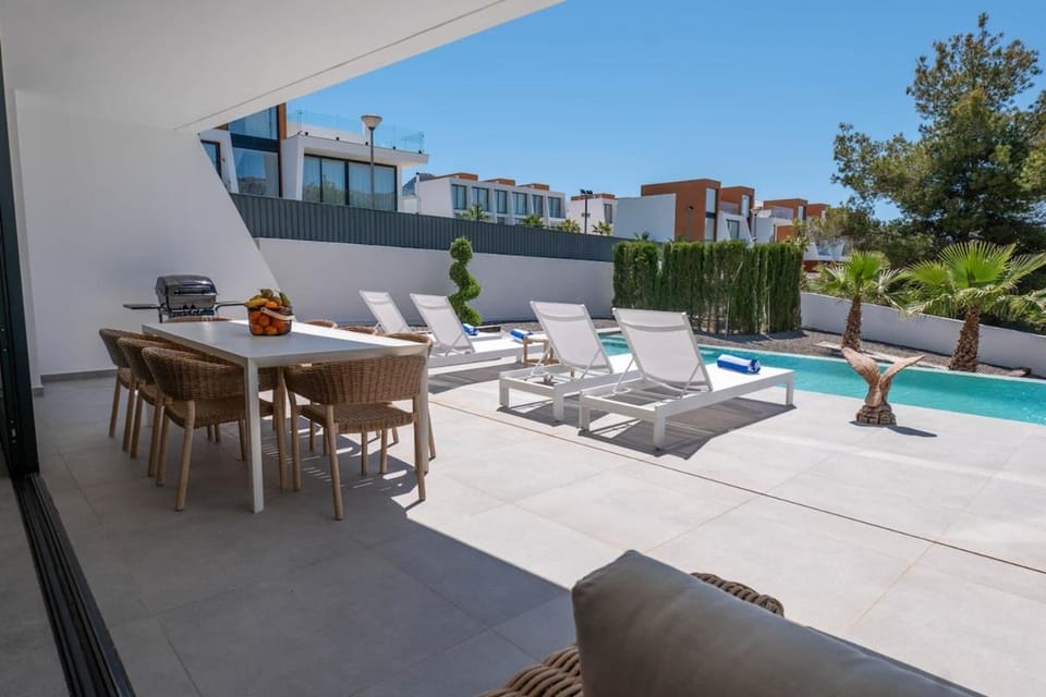 Property building, Patio, Day, BBQ facilities, View (from property/room), Balcony/Terrace, Balcony/Terrace, Living room, Seating area, Dining area, Pool view, Swimming pool, Swimming pool, sunbed