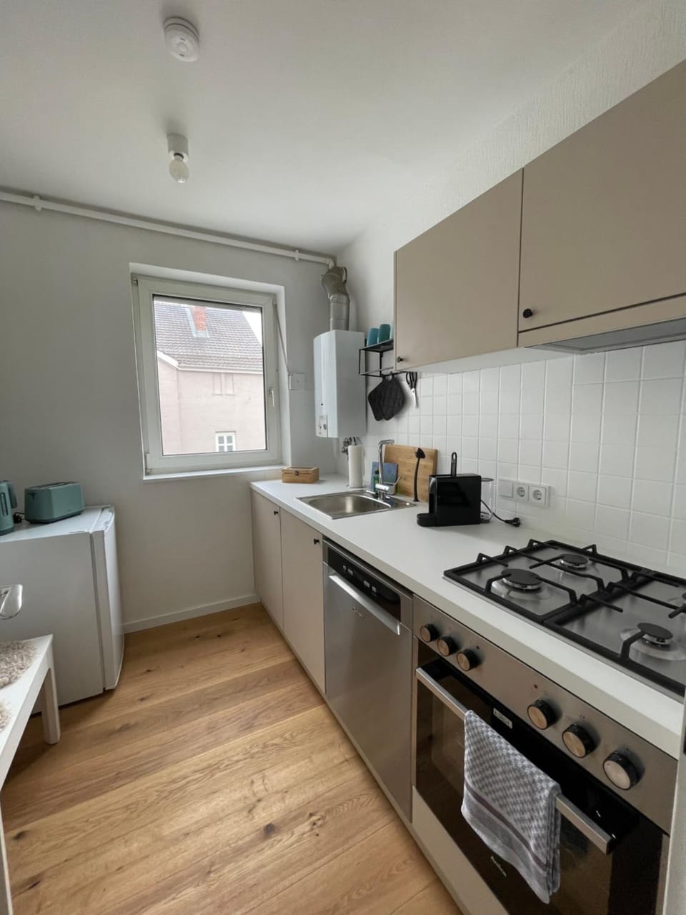 Kitchen or kitchenette, dishwasher, stove, toaster