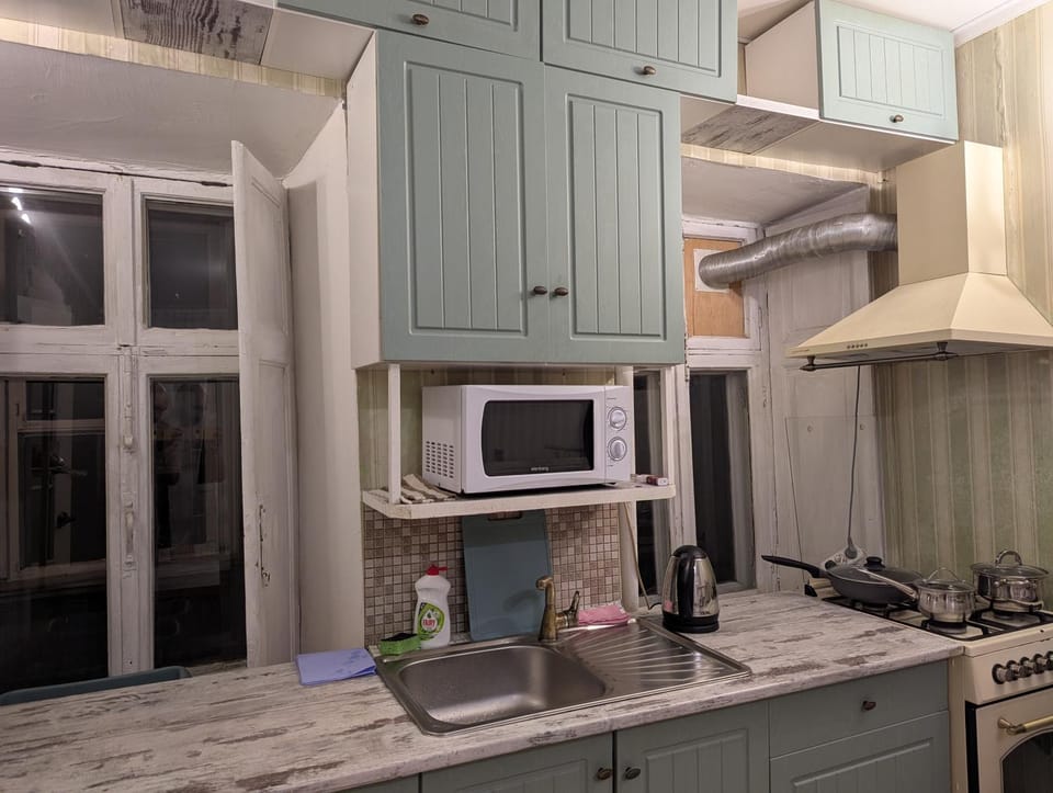 Kitchen or kitchenette, microwave, oven, stove