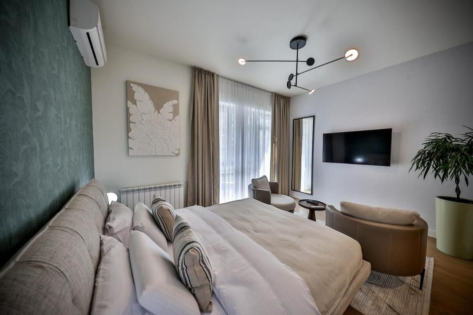 Bed, Living room, Seating area, Bedroom