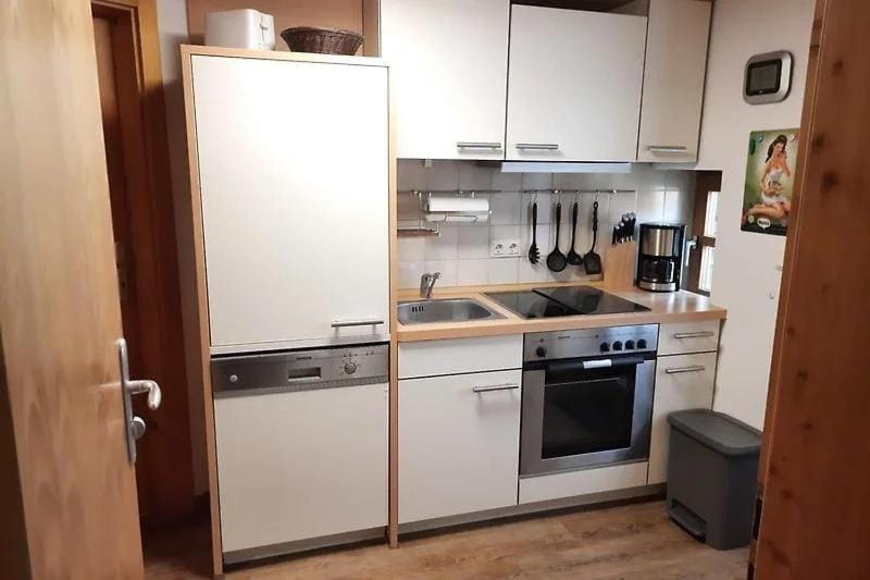 Kitchen or kitchenette, dishwasher, oven, stove, toaster