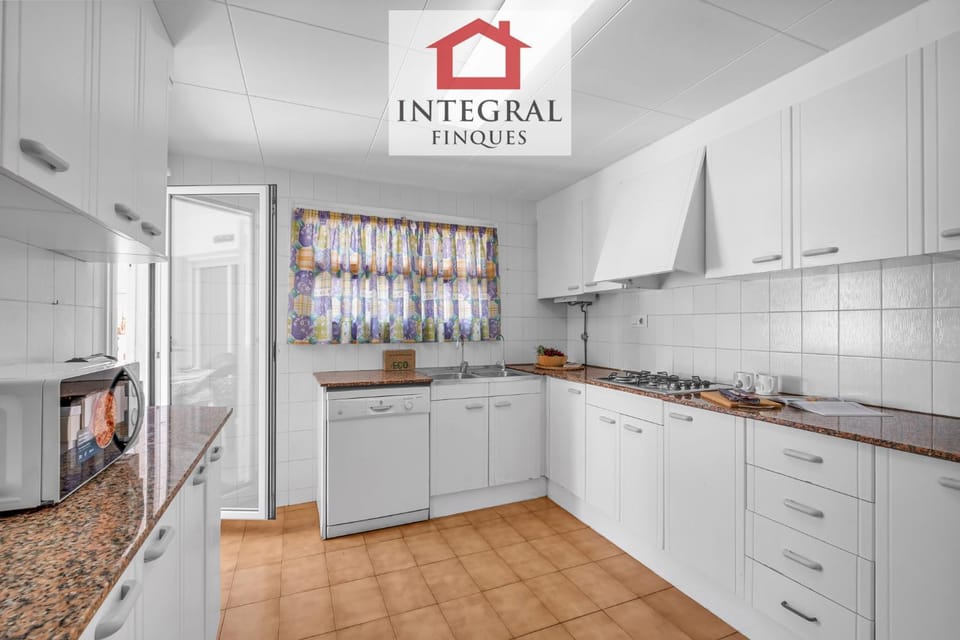 Photo of the whole room, dishwasher, microwave, stove, kitchen