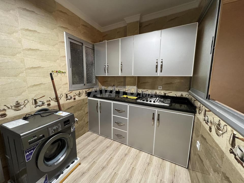 Kitchen or kitchenette, stove, washing machine