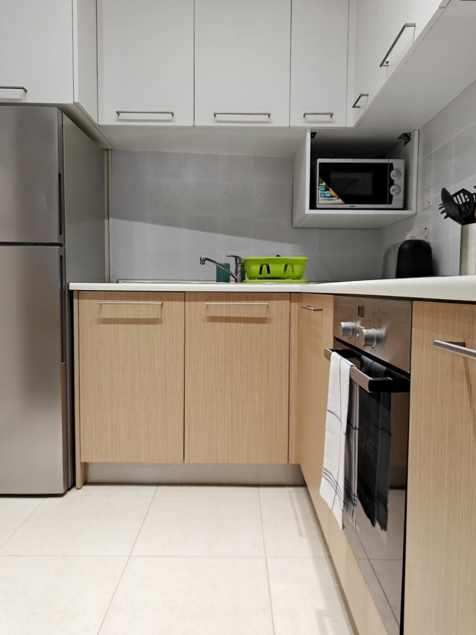 Kitchen or kitchenette, microwave, oven, toaster