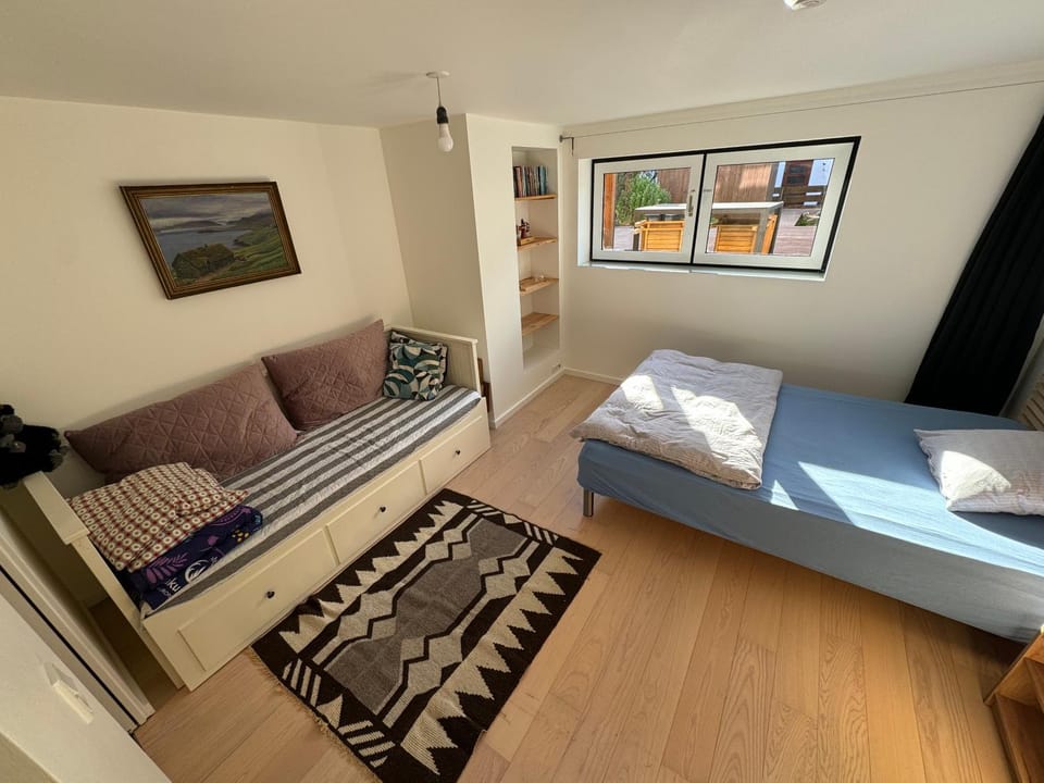 Bed, Living room, Seating area, Bedroom