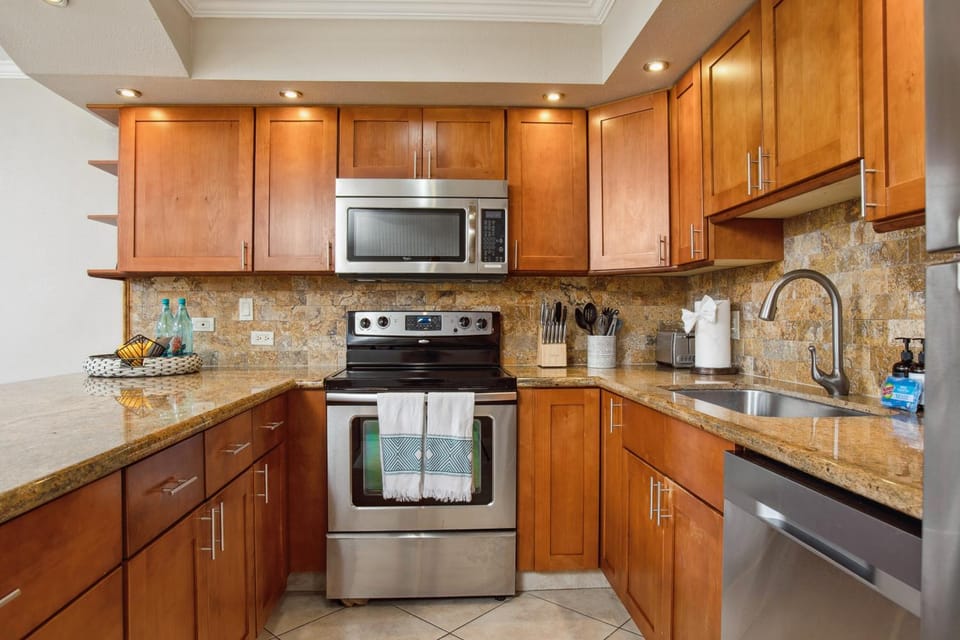 Kitchen or kitchenette, dishwasher, oven, stove, toaster