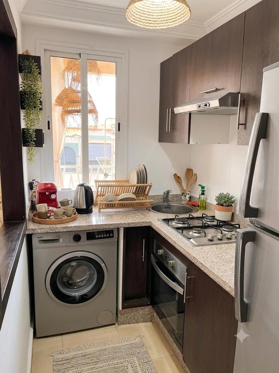 Kitchen or kitchenette, oven, stove, toaster, washing machine