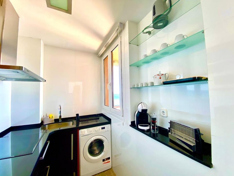 Kitchen or kitchenette, dishwasher, oven, stove, washing machine