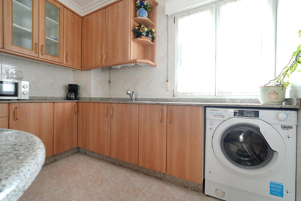Kitchen or kitchenette, washing machine