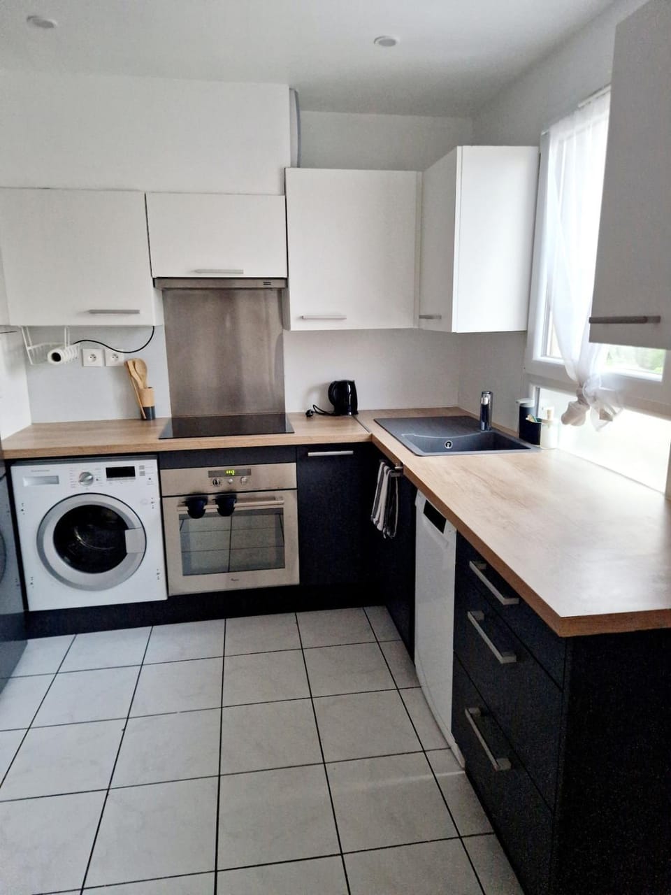 Kitchen or kitchenette, dishwasher, oven, washing machine, dryer