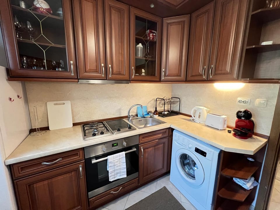 Kitchen or kitchenette, oven, stove, toaster, washing machine