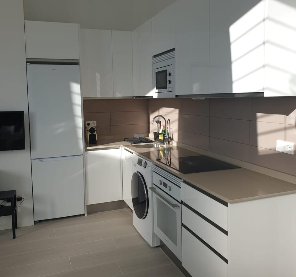 Kitchen or kitchenette, microwave, oven, stove