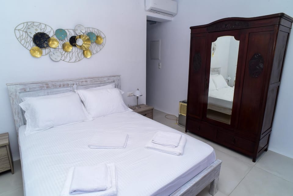 Bed, towels, wardrobe