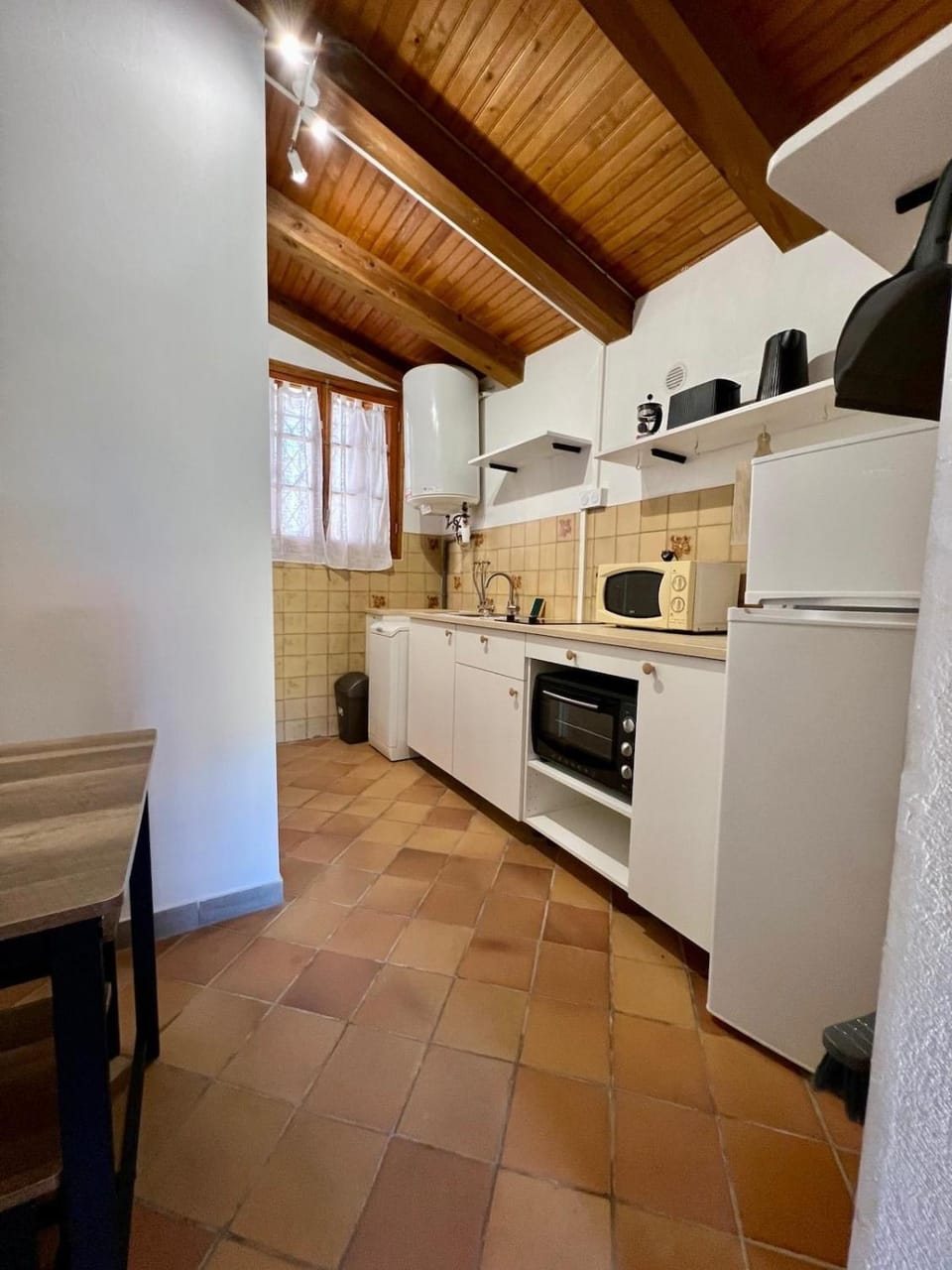 Kitchen or kitchenette, dishwasher, oven, stove, toaster