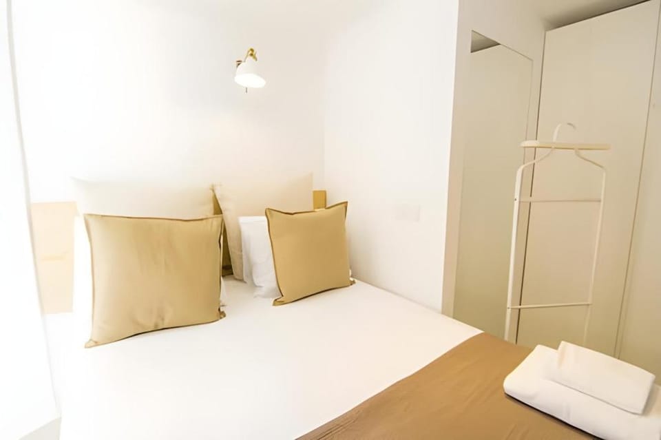 Bed, towels, wardrobe