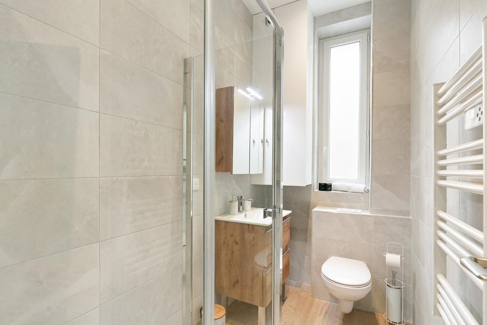 Shower, Toilet, Bathroom, hair dryier, towels