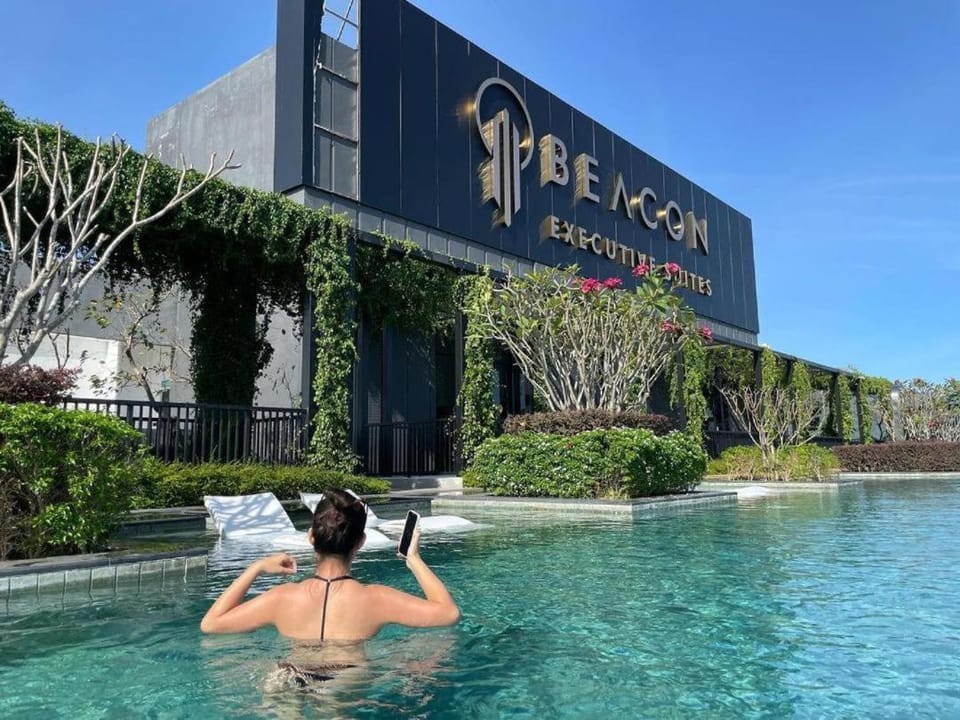 Property building, Nearby landmark, Spring, Day, People, Natural landscape, Garden, Text overlay, Guests, Pool view, Swimming pool, Swimming pool