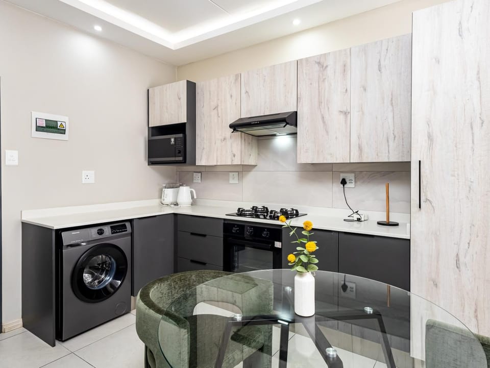 Kitchen or kitchenette, oven, stove, washing machine