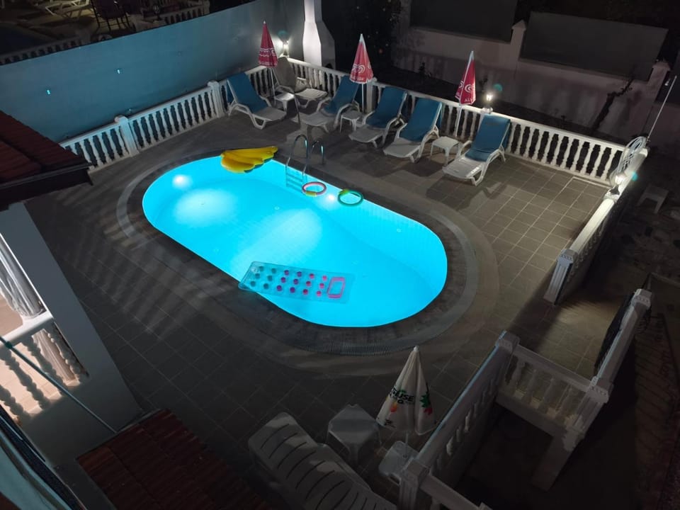 Night, Pool view, Swimming pool, sunbed
