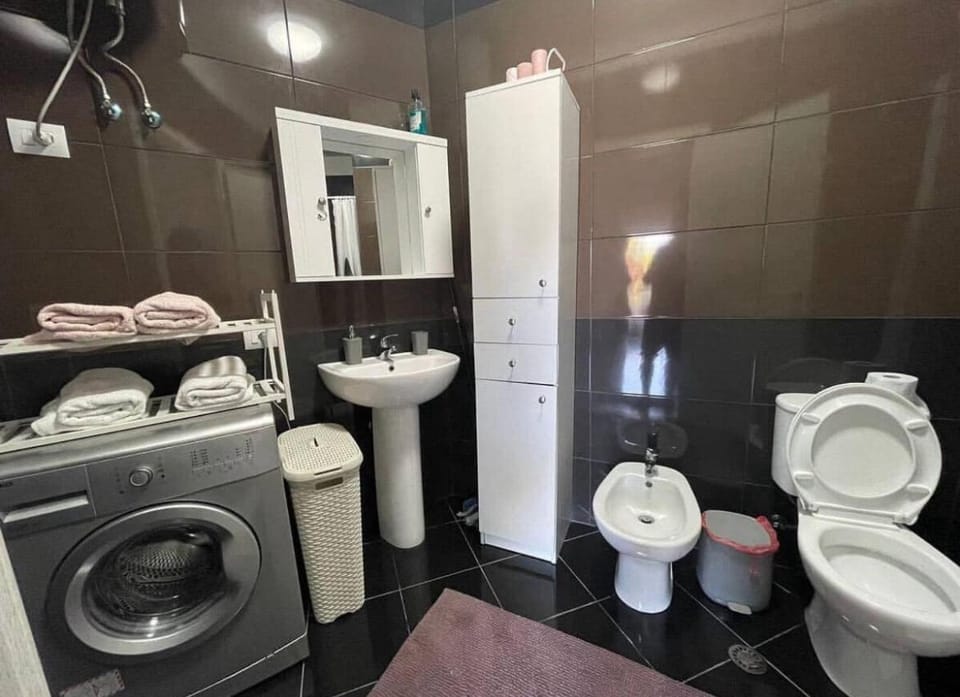Shower, Toilet, Bathroom, bidet, towels, washing machine, dryer