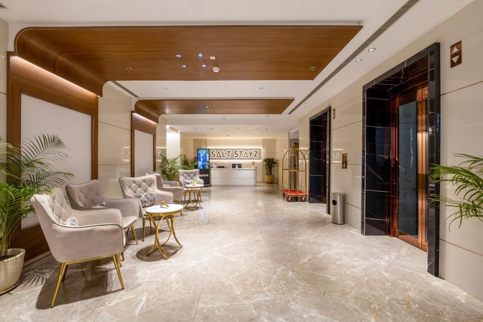 Property logo or sign, Lobby or reception, Seating area, elevator, air conditioner