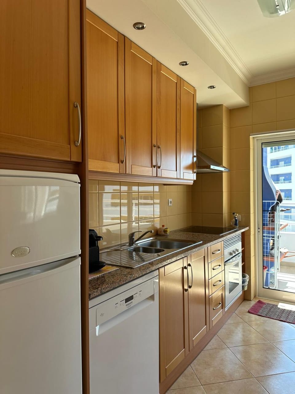Kitchen or kitchenette, dishwasher, oven, stove