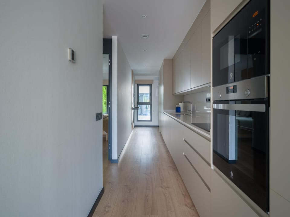 Photo of the whole room, microwave, oven