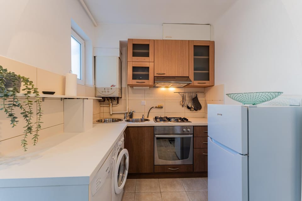 Kitchen or kitchenette, oven, stove, washing machine, dryer