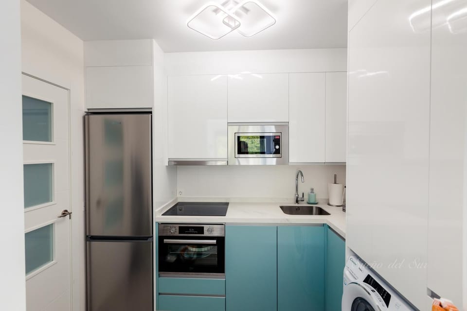 Kitchen or kitchenette, dishwasher, microwave, oven, stove