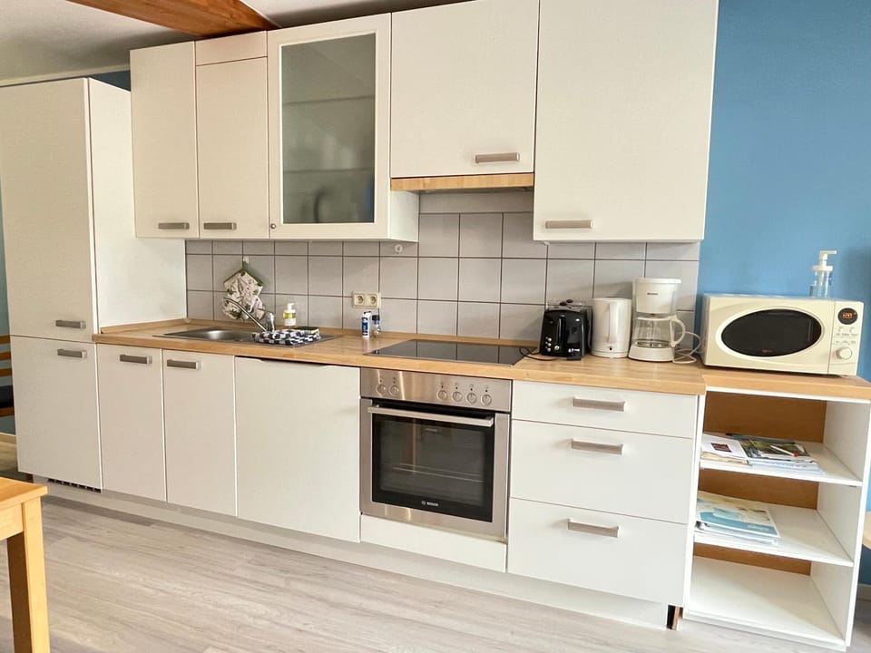 Kitchen or kitchenette, dishwasher, microwave, oven, toaster, kitchen