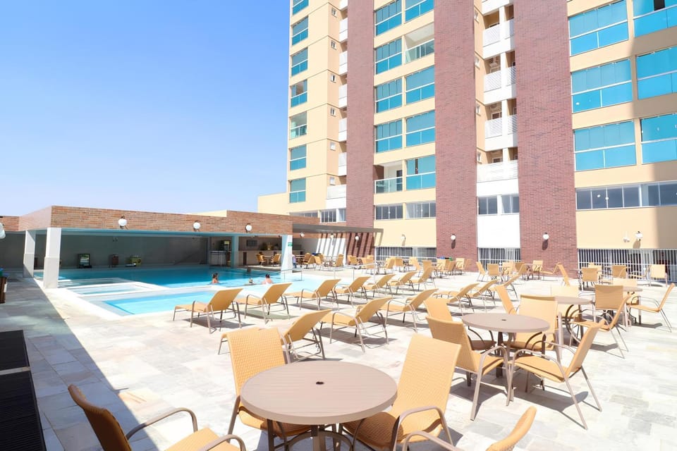 Property building, Patio, Communal lounge/ TV room, Day, Evening entertainment, Pool view, Swimming pool, sunbed