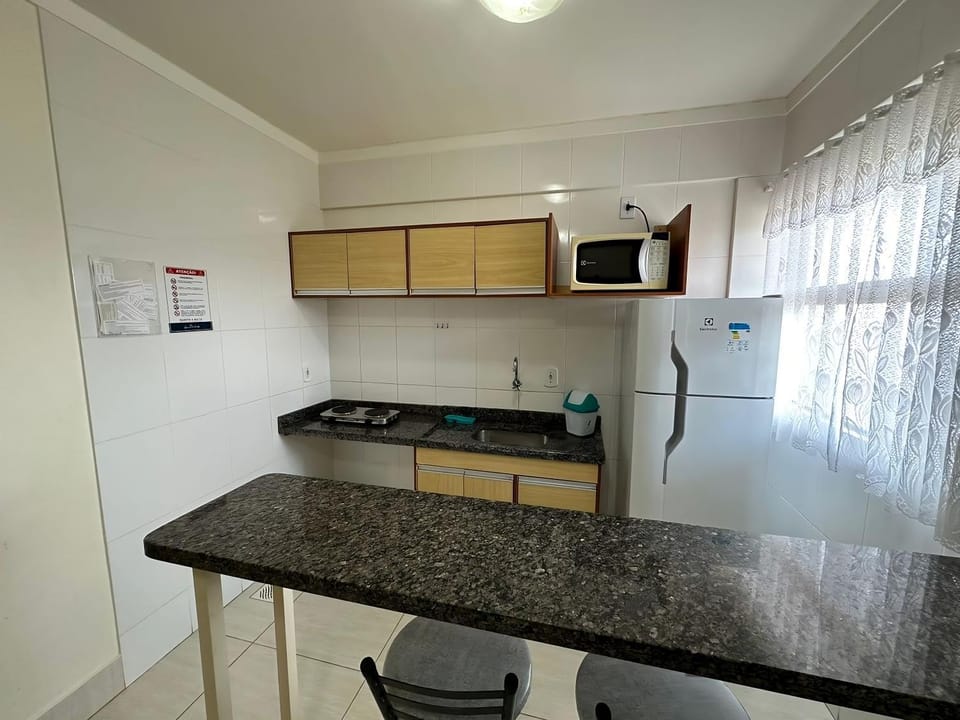 Kitchen or kitchenette, minibar, stove