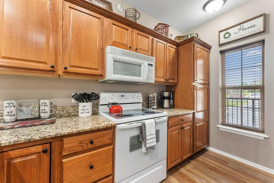 Kitchen or kitchenette, dishwasher, oven, stove
