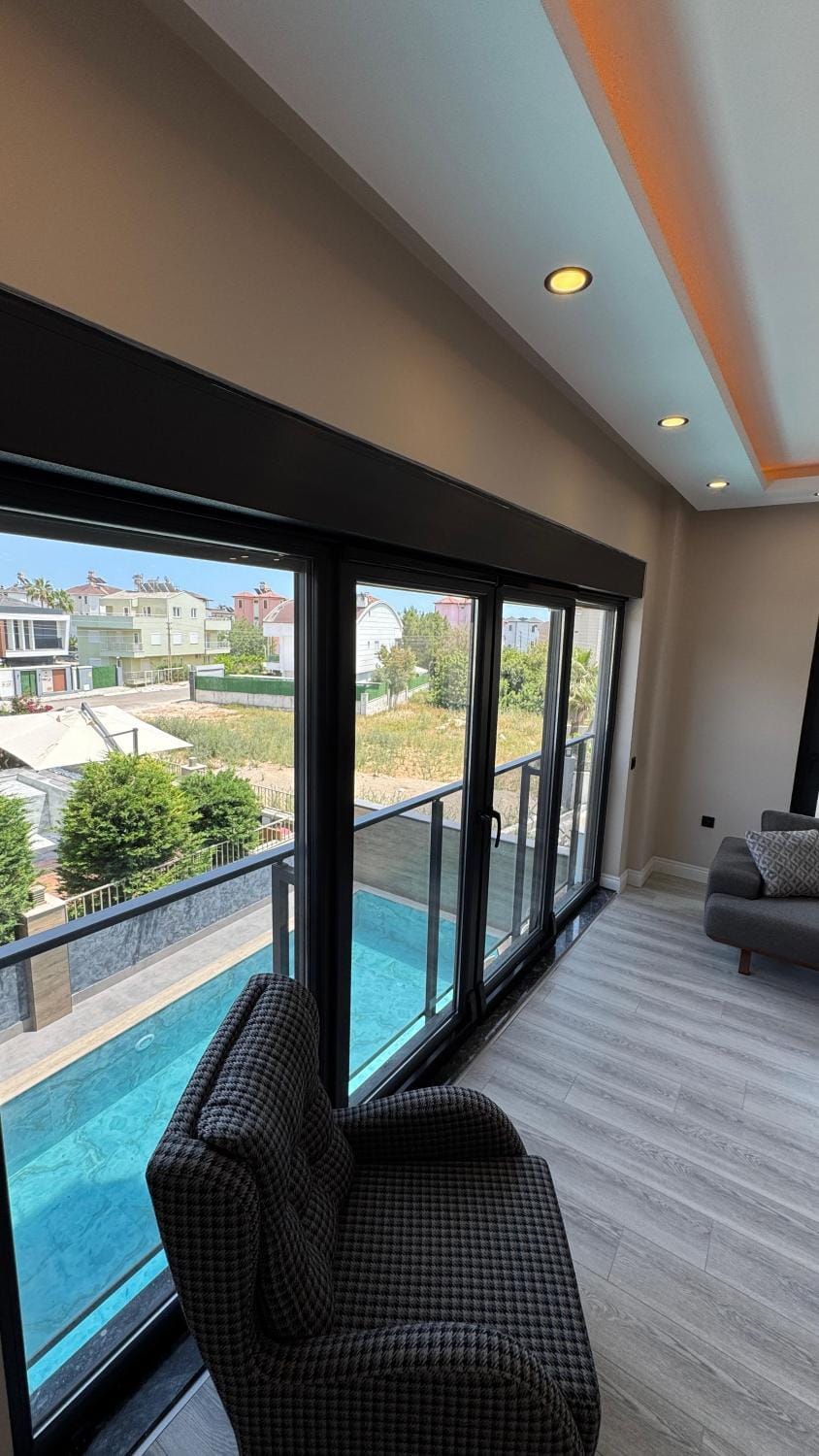 Living room, Seating area, Pool view