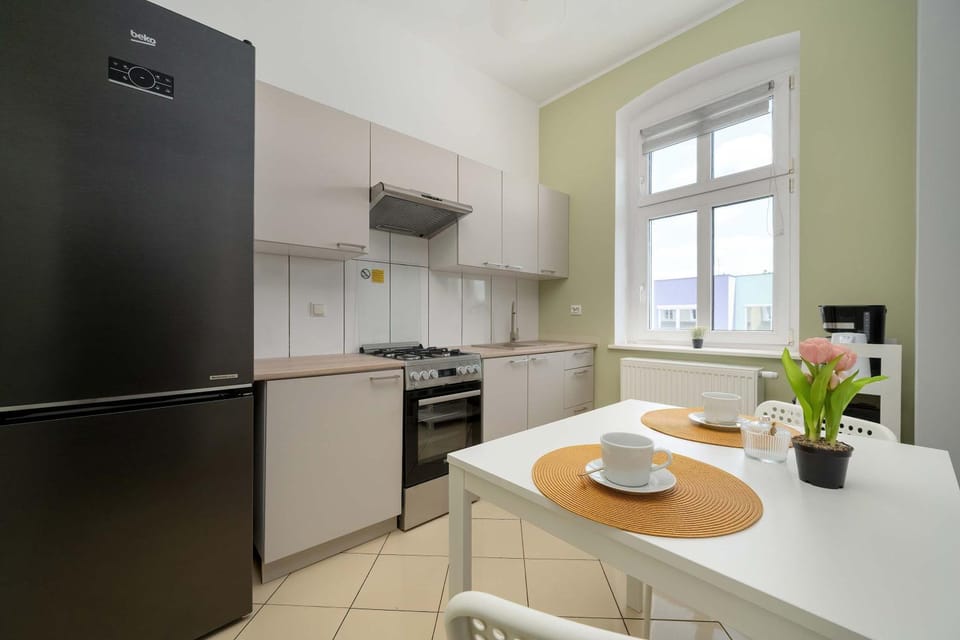 Kitchen or kitchenette, dishwasher, oven, stove