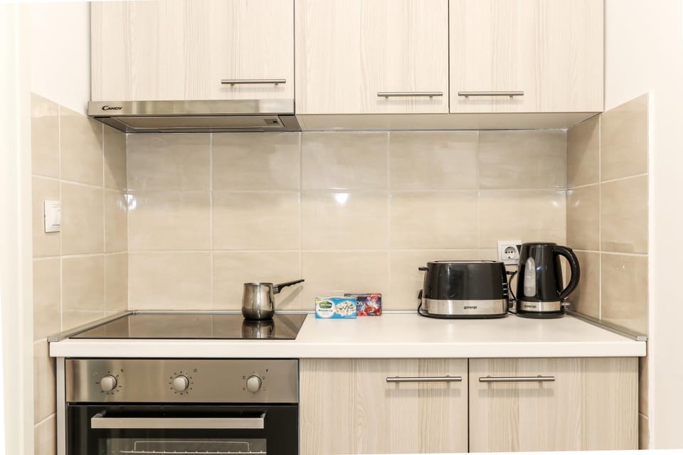 Kitchen or kitchenette, stove, toaster