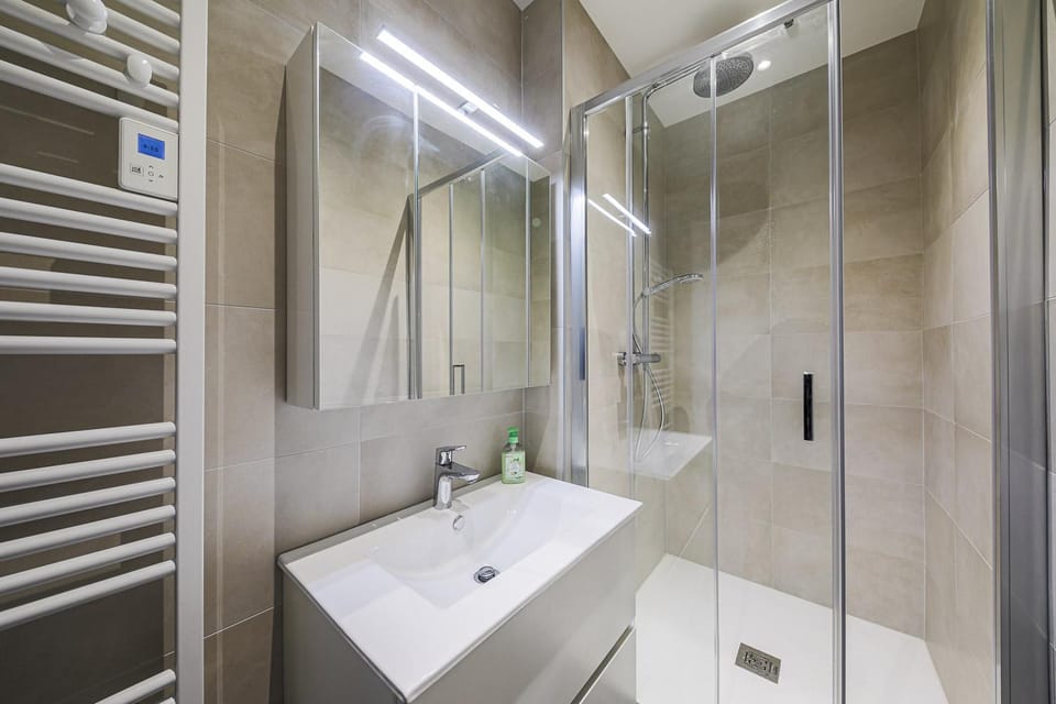 Shower, Bathroom, hair dryier, storage, towels