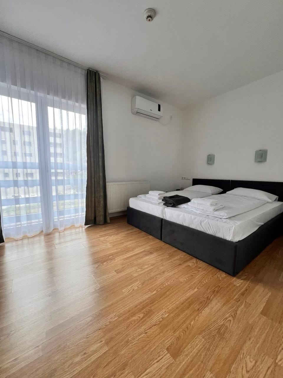 Bed, Photo of the whole room, Bedroom, towels, air conditioner