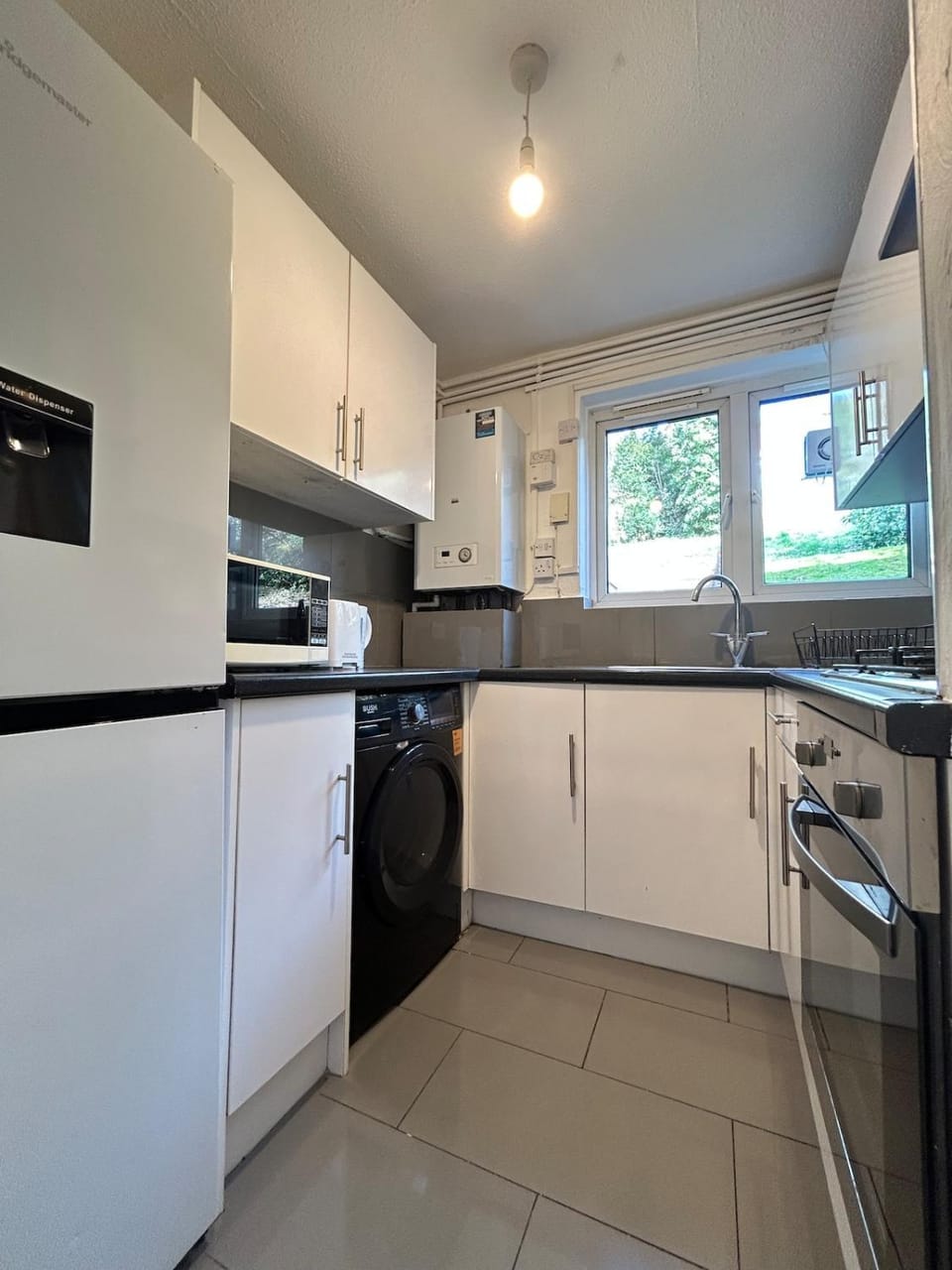 Kitchen or kitchenette, oven, toaster, laundry, laundry