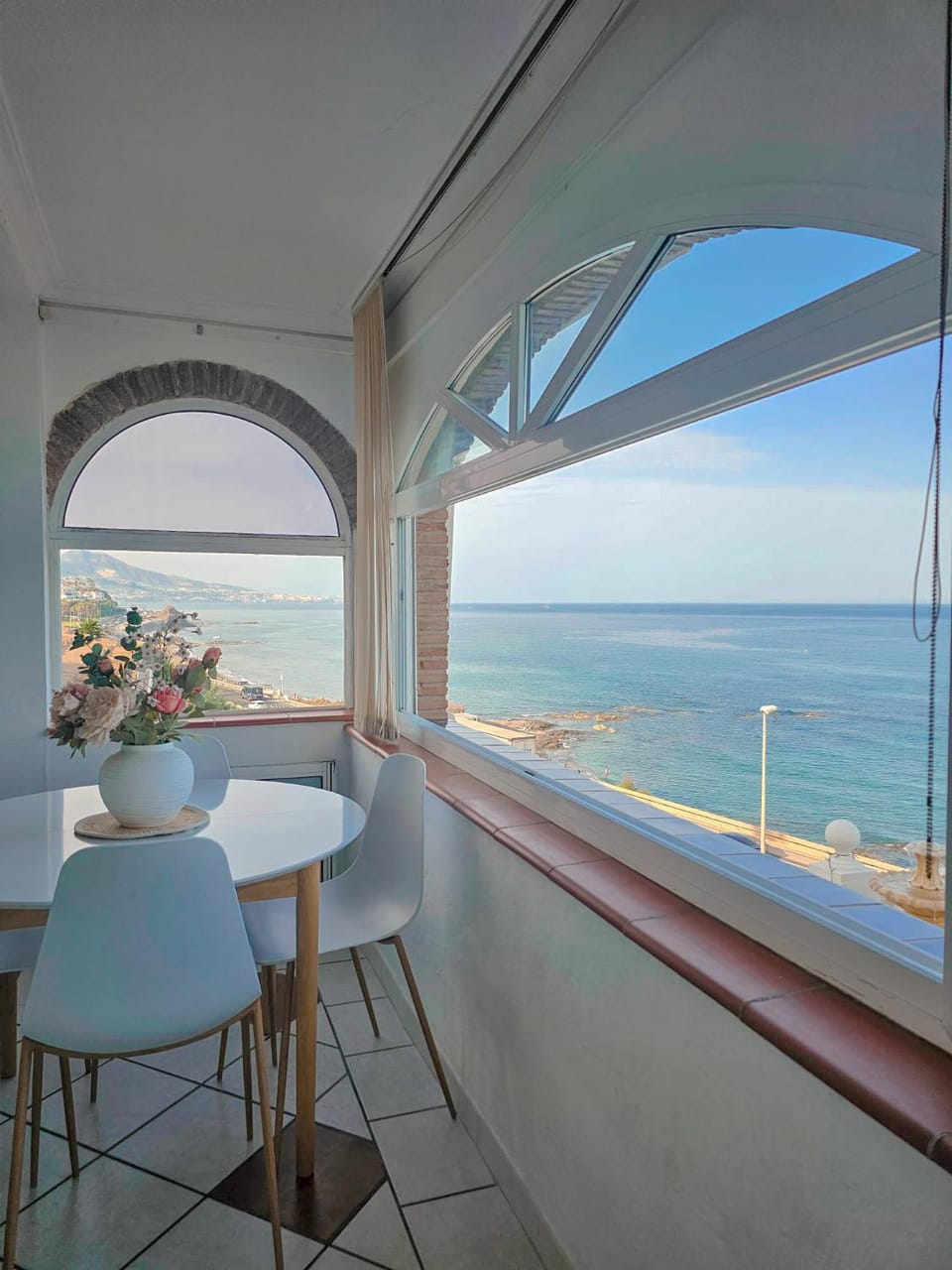 View (from property/room), Living room, Seating area, Dining area, Sea view