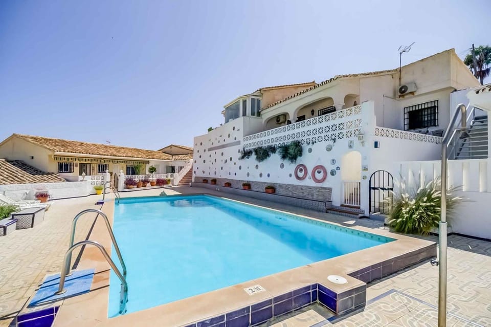 Property building, Patio, Pool view, Swimming pool, sunbed