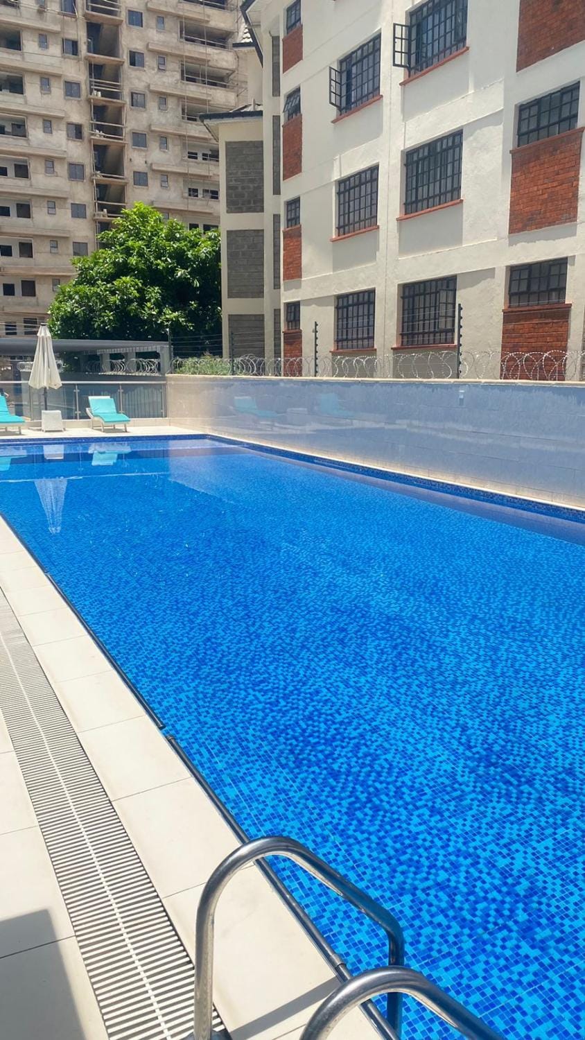 stunning two bedroom apartment with swimming pool, fully equipped gym, private parking space, children playground and unbeatable scenic city views Apartment in Nairobi